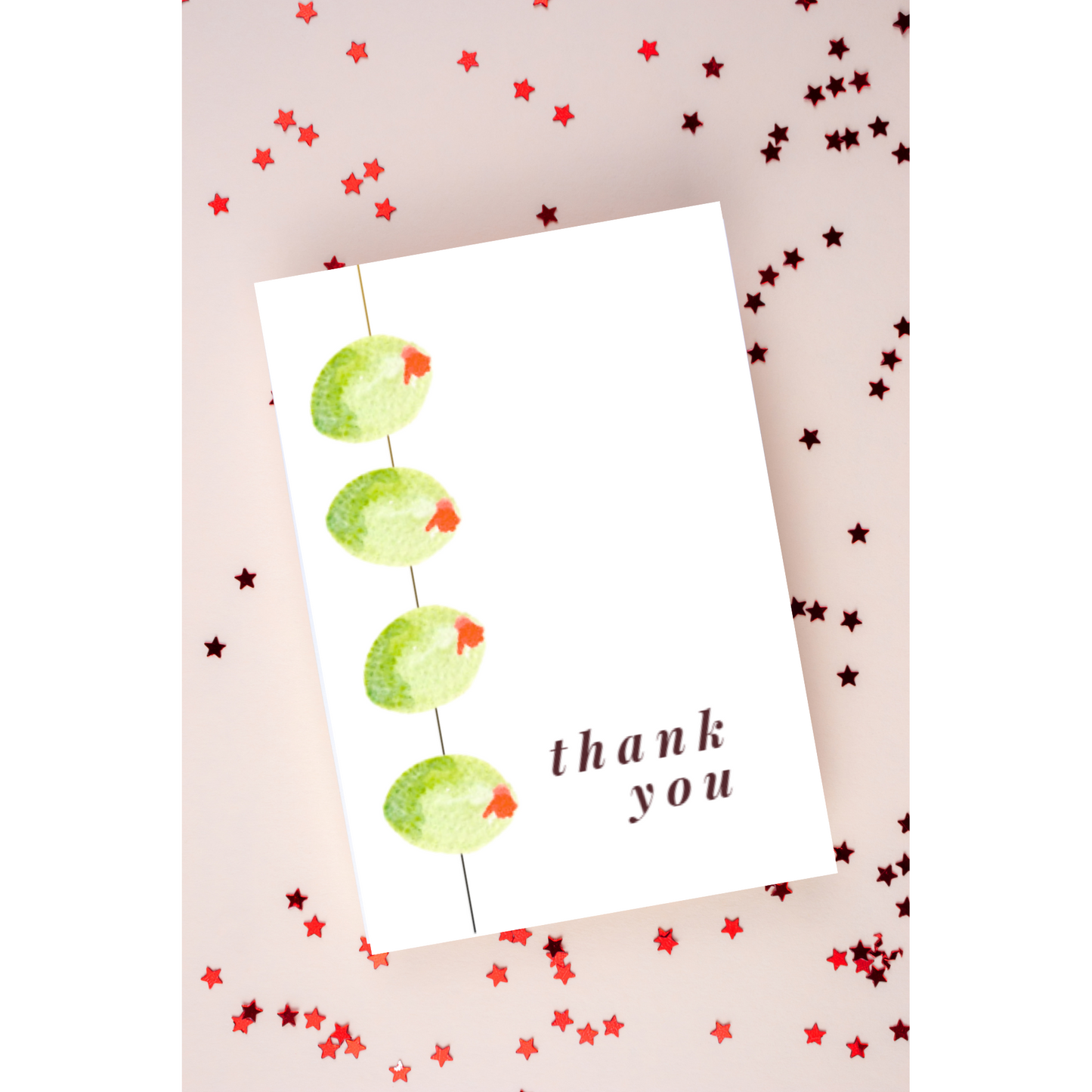 A thank you card featuring a delicate watercolor illustration of olives on a stick, with soft green and purple tones. The design is elegant and inviting, perfect for expressing gratitude. The card has a simple, blank interior for personal messages 1